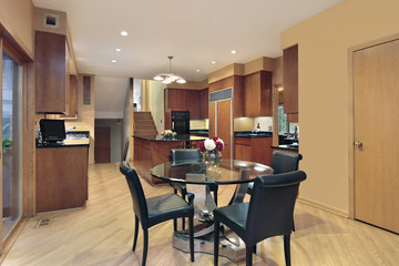 Kitchen with wood paneled refrigerator