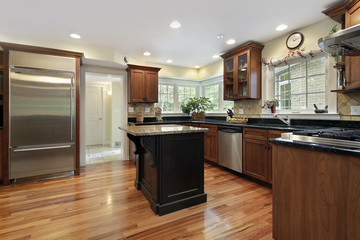 Kitchen with black and granite island