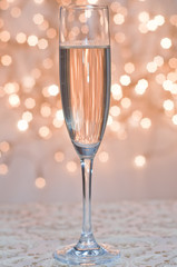 Glass of champagne against golden background