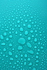 Blue water drops background with big and small drops