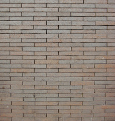 gray brownslightly reflective brick wall