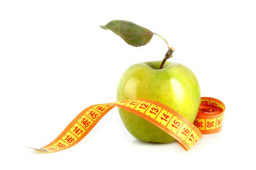 Fresh red tasty apple with measuring tape isolated on white