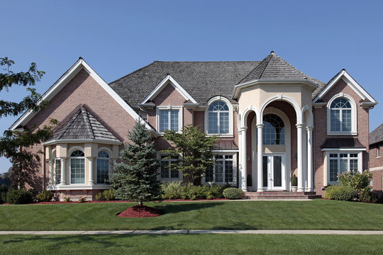 Large brick home with columned entryway