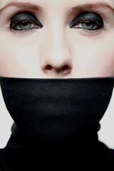 Young woman with covered mouth
