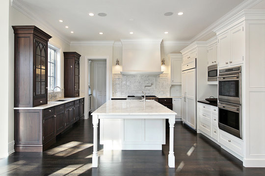 Kitchen with dark and light cabinetry