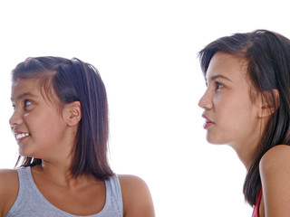 two happy teenage girls talking