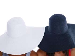 girls hiding under hats