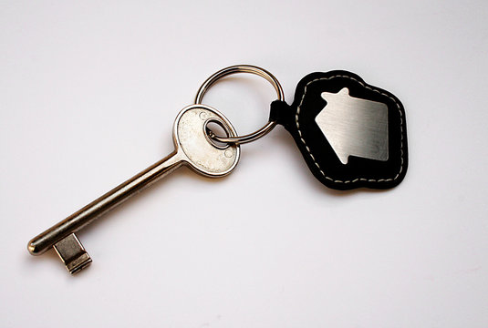 Isolated key with house icon