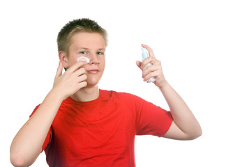 The boy, the teenager with a cream for a problem youthful skin
