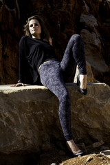 woman poses on a stone quarry