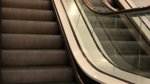 View down of two modern escalators in movement