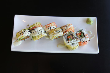 Traditional sushi rolls on the dish.