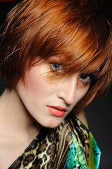 Beautiful red heaired woman portrait with fashion hairstyle and