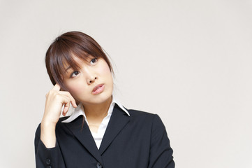 a portrait of young business woman thinking