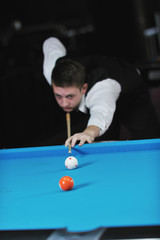 Fototapeta premium young man play pro billiard game