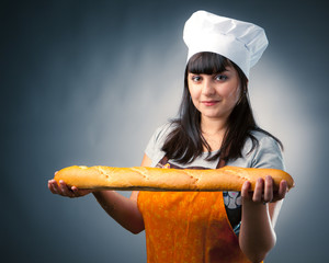 woman cook holding fresh baked bread