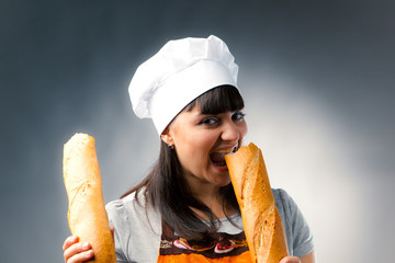 woman cook tasting a french bread