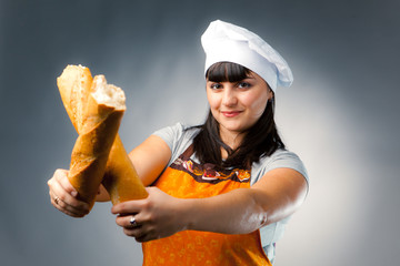 woman cook crossing a french bread