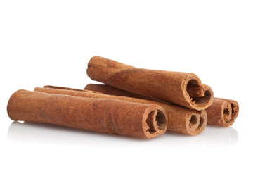 Cinnamon sticks on white background