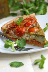 Tomato, basil and pesto gruyere on a plate