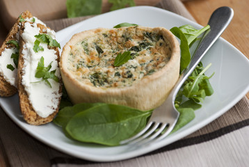 Spinach quiche with watercress and toast