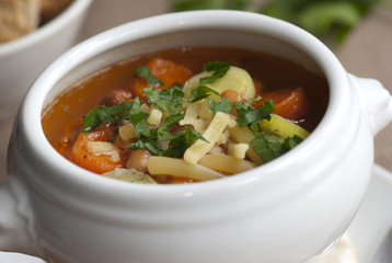 Bacon, bean and pasta soup in a bowl