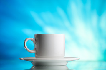 Obraz na płótnie Canvas cup of tea on blue