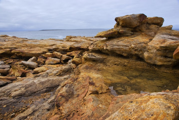 Fototapeta na wymiar Yellow stones on the Arctic Coast