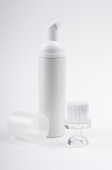 cosmetic bottle and brush for face cleaning