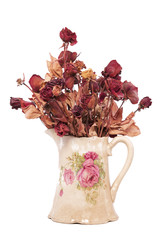 A Vintage Vase filled with Dried Red Roses