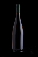 wine bottle over black background