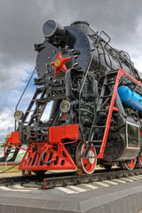 Obraz premium Ancient steam locomotive with red star