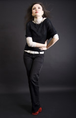 full-length portrait of a young fashionable brunette