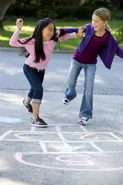 Girls Playing Hopscotch