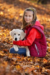 Little happy girl with puppy