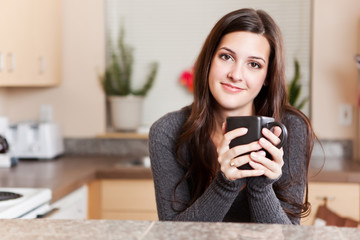 Woman holding coffee cup