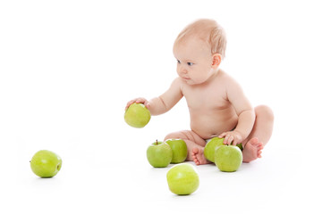 Fototapeta na wymiar Little baby playing with apples