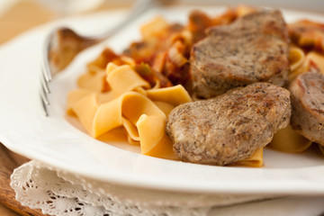 Pork fillet with pasta and mushroom sauce