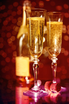 Elegant champagne glasses and bottle