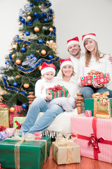 Fototapeta na wymiar Happy family with Christmas presents