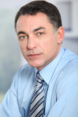 Closeup of businessman with blue shirt and tie