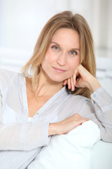 Fototapeta premium Closeup of beautiful blond woman relaxing at home