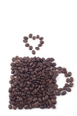 cup made out of dark roasted fair trade coffee beans isolated on