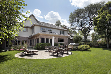 Fototapeta premium Rear view of home with patio and grill