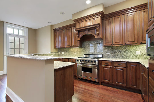 Kitchen with granite backsplash