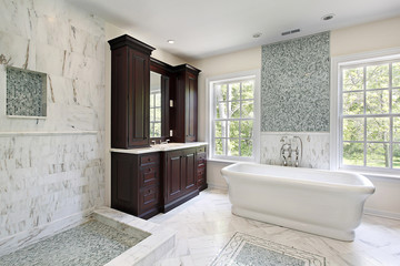 Master bath with white tub