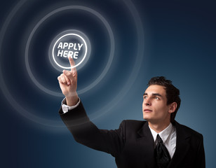 man pressing a touchscreen button