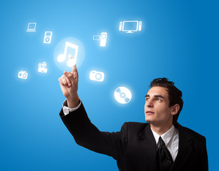 man pressing a touchscreen button