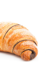 French croissant with chocolate on white background