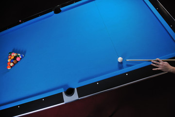 young man play pro billiard game